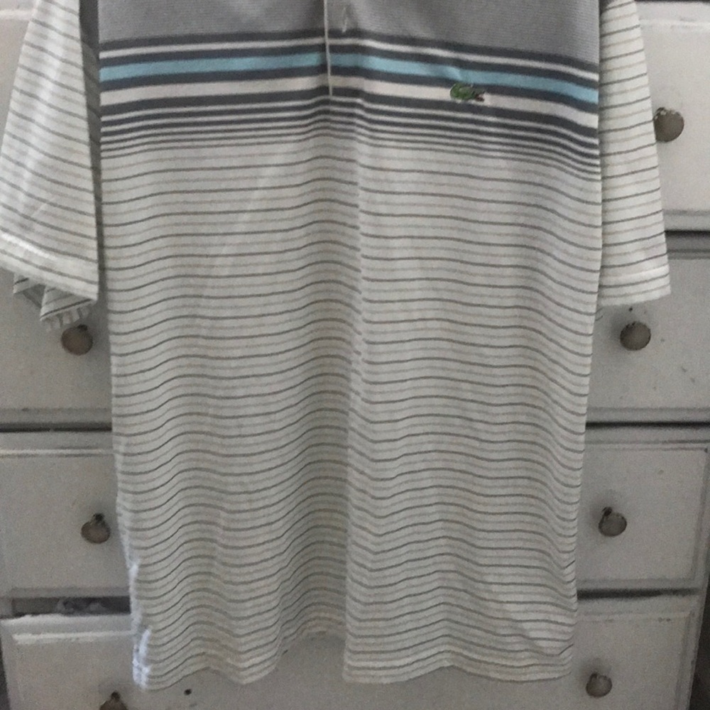 Light blue and light grey color polo shirt.